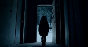little-girl-in-dark-doorway